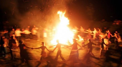Belarusian neo-pagans dance around a bonfire celebrating the summer solstice in small town Rakov, some 45 kilometers (28 miles) northwest from Minsk, Saturday, June 23, 2007. The festivities of Ivan Kupala, or John the Baptist, is similar to MardiGras and reflects pre-Christian Slavic traditions and practices. (AP Photo/Sergei Grits)